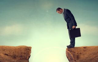 businessman nervously facing an obstacle challenge